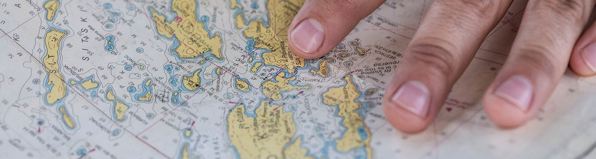 A hand resting on a map